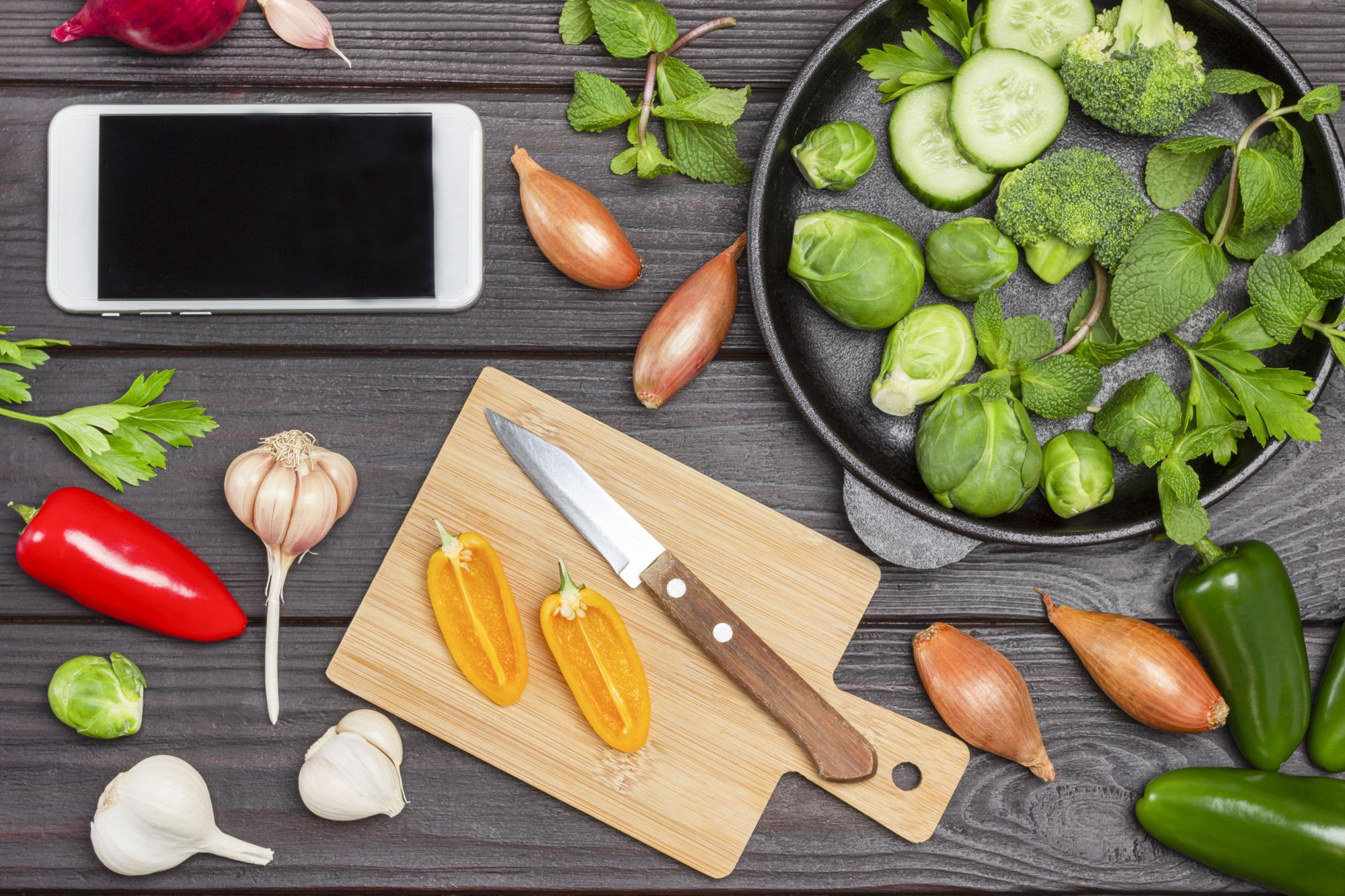 Close-up of herbs and tools on a wooden board