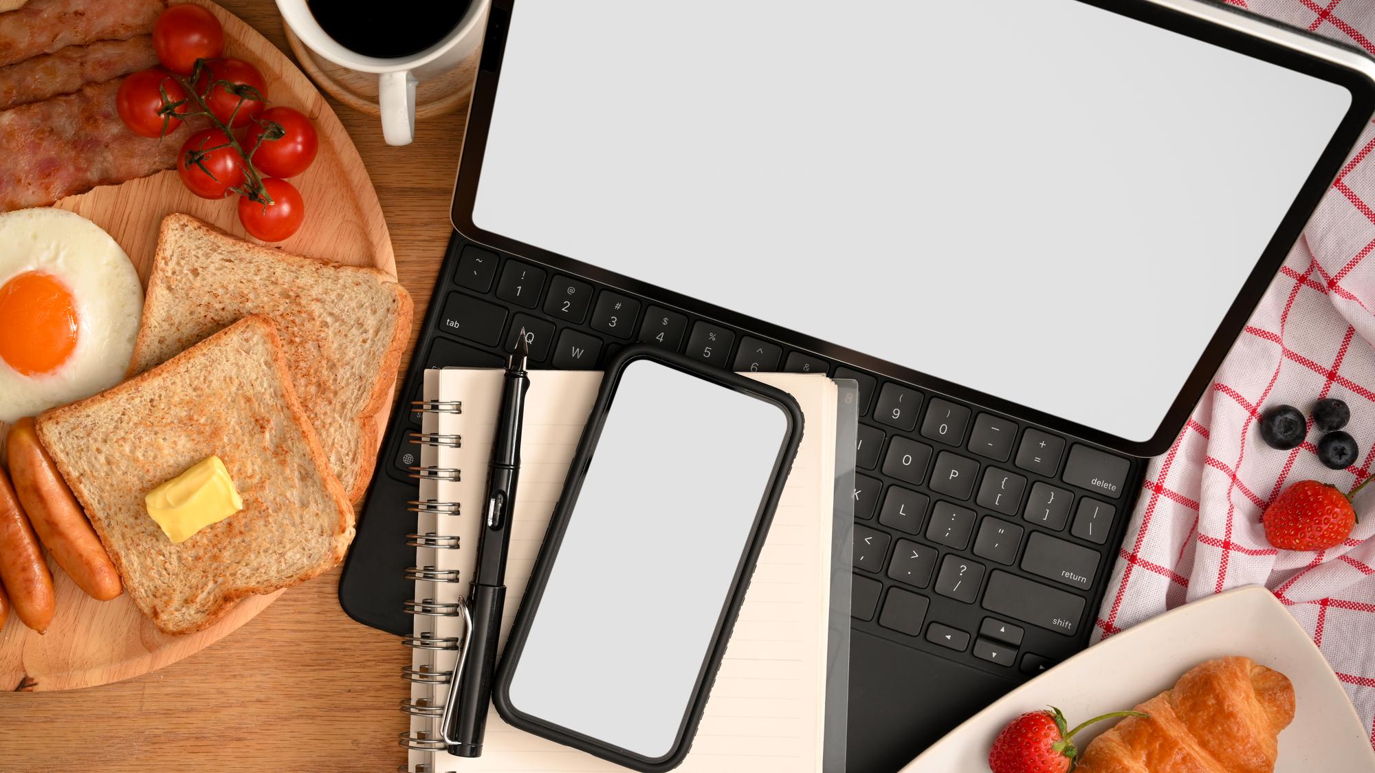 Flat lay: course workbook, phone, and notes